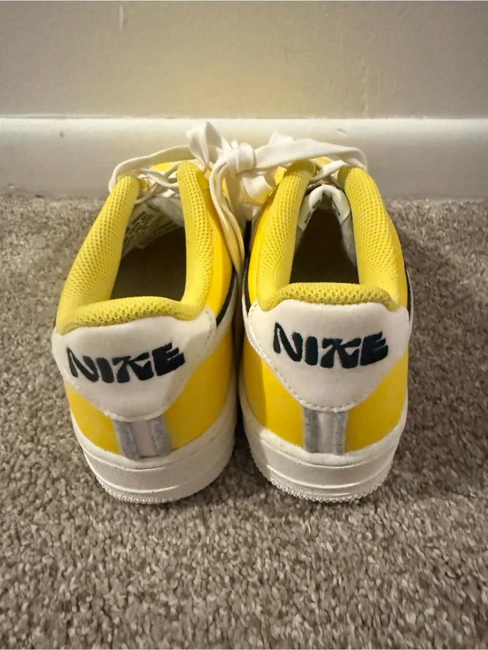 Nike Yellow & White Low-Top Sneakers with Black Swoosh Outline